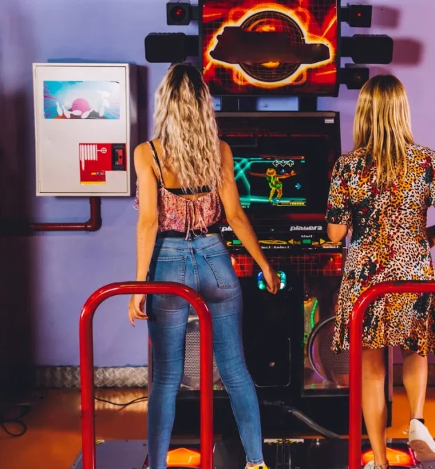 back-view-women-playing-dancing-arcade_23-2148253104
